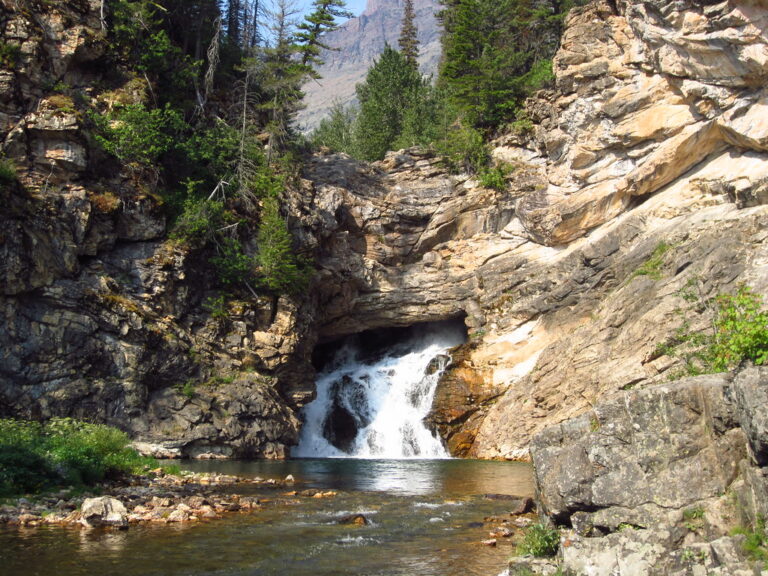 Running Eagle Falls - [Two Medicine Area] - 4 (Early in the season when there is more water flowing, it cascades from both over the top of the cliff a